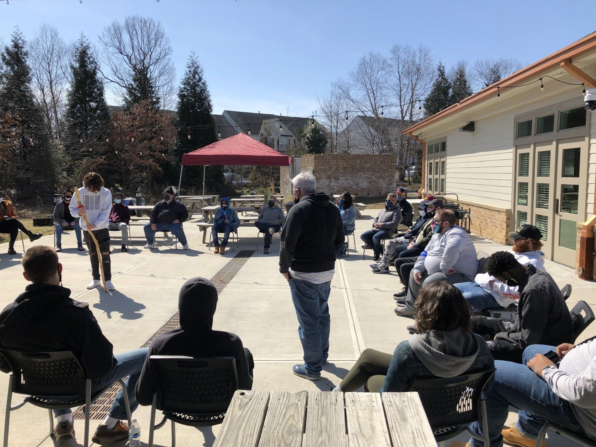 Boys to men mentoring outdoor meeting.